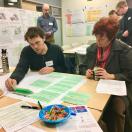 Residents debating strategy prioritization at Village on Park Street community rooms